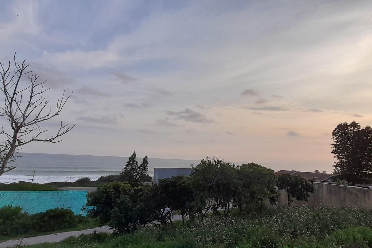A scenic view overlooking the coastline and ocean, capturing the natural landscape and horizon.