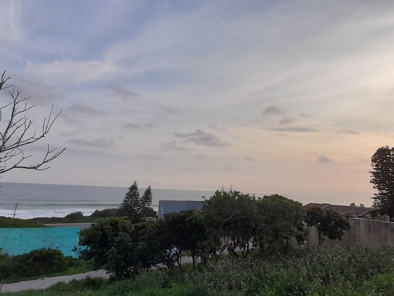 A scenic view overlooking the coastline and ocean, capturing the natural landscape and horizon.