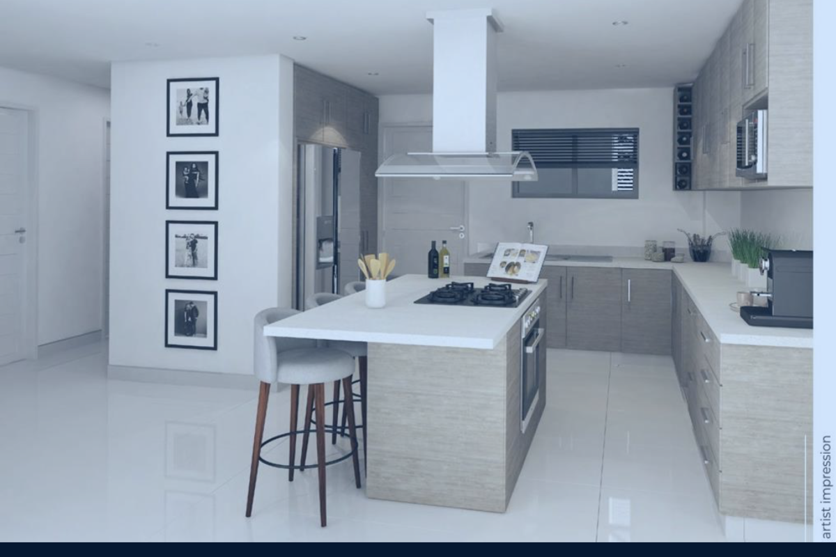 Modern kitchen featuring a central island, built-in oven, gas hob, and sleek cabinetry with integrated extractor fan.