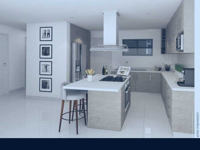 Modern kitchen featuring a central island, built-in oven, gas hob, and sleek cabinetry with integrated extractor fan.