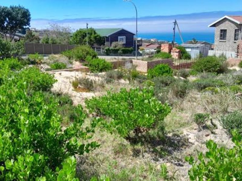A view of the surrounding residential neighborhood and coastal landscape from the vacant residential land.