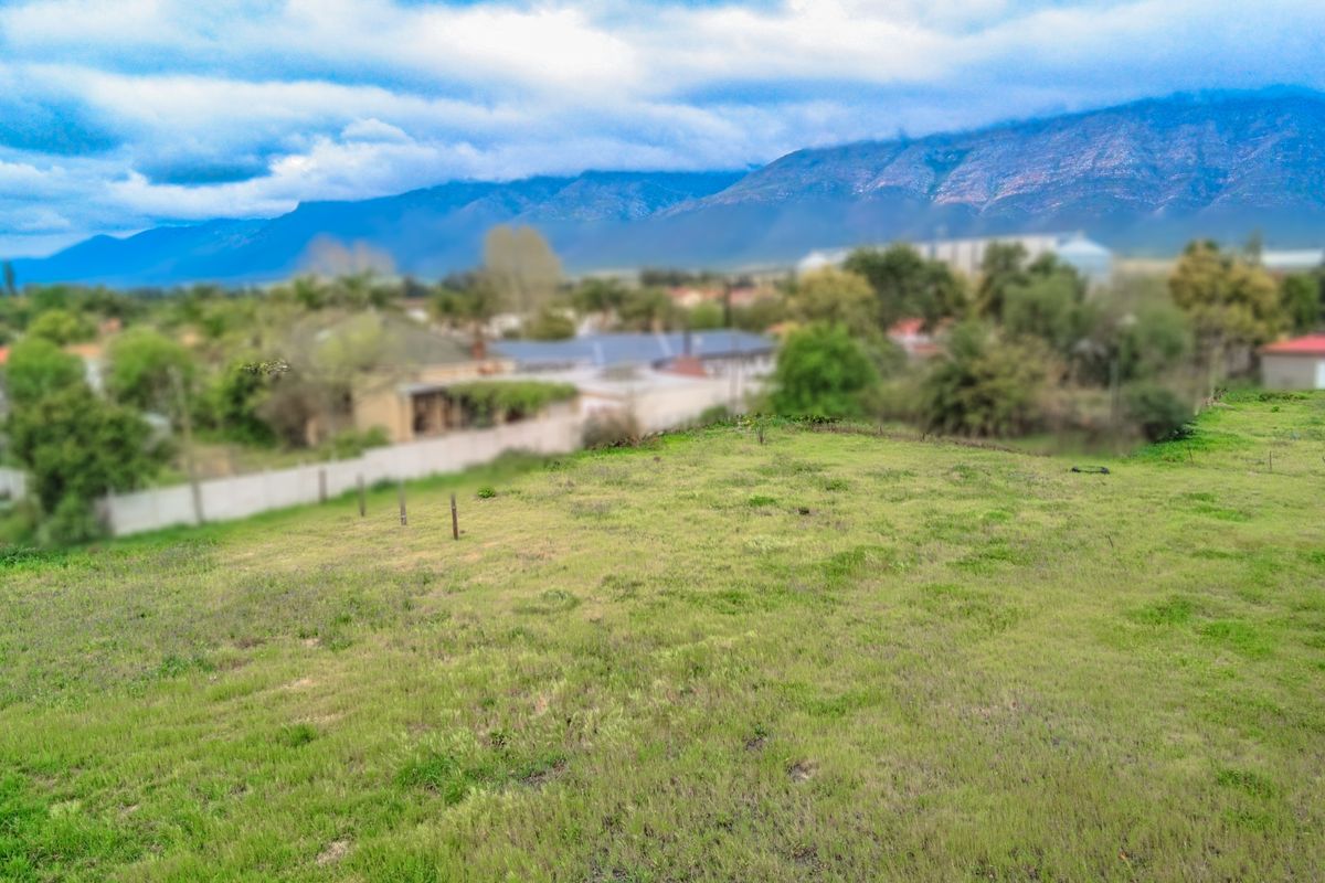 A view of the vacant residential land with mountain vistas in the background.
