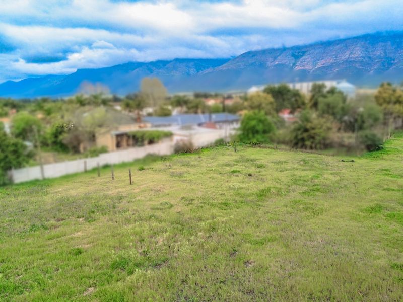 A view of the vacant residential land with mountain vistas in the background.