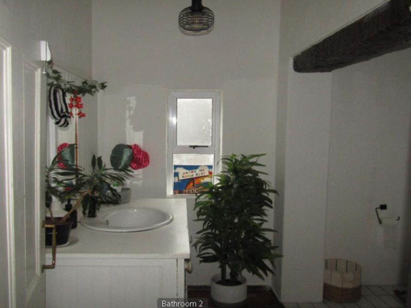 **Property Overview: Charming Family Home in the Heart of Melville** - Photo 4