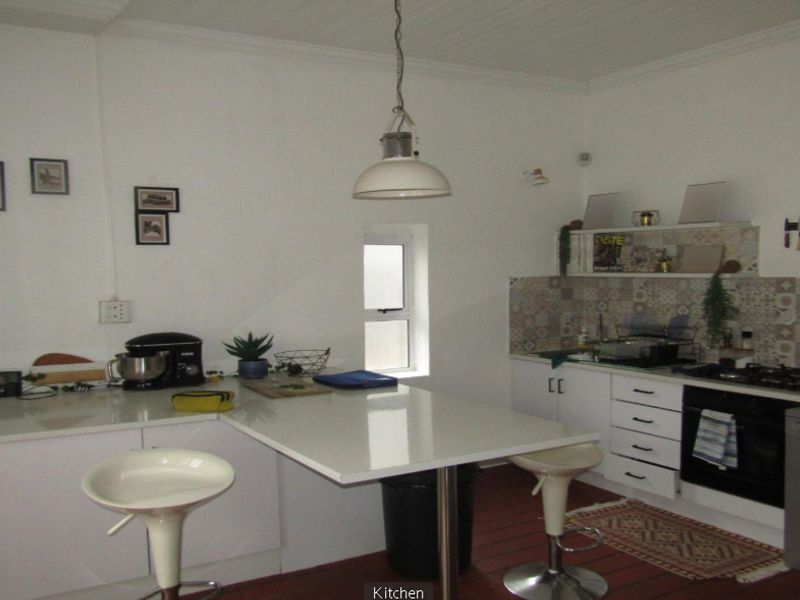 **Property Overview: Charming Family Home in the Heart of Melville** - Photo 2