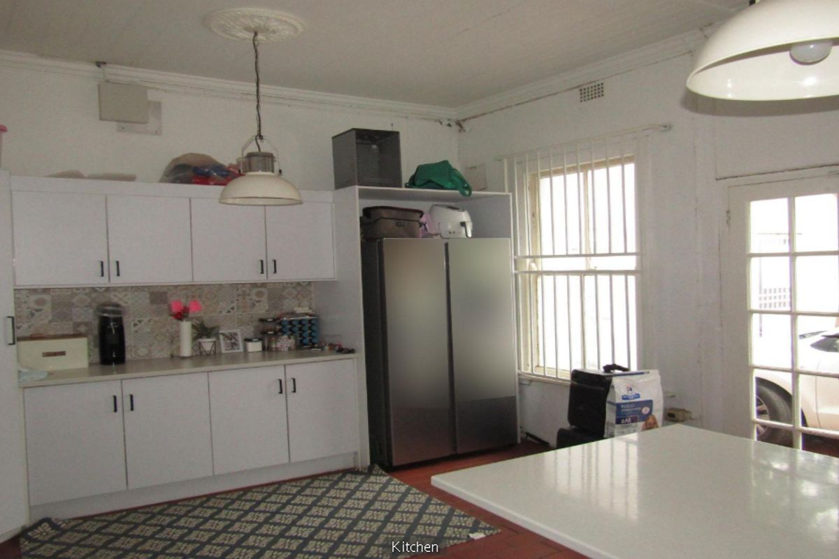 **Property Overview: Charming Family Home in the Heart of Melville** - Photo 5