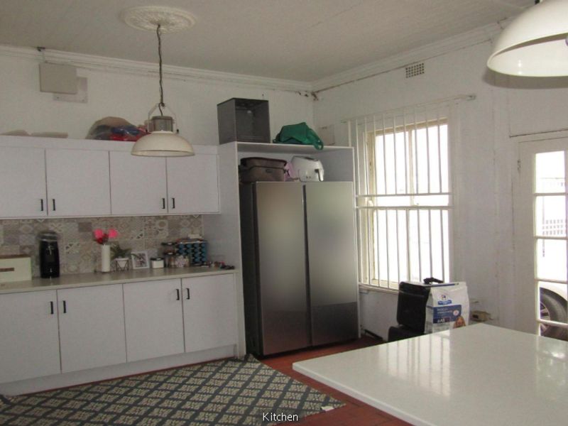 **Property Overview: Charming Family Home in the Heart of Melville** - Photo 5