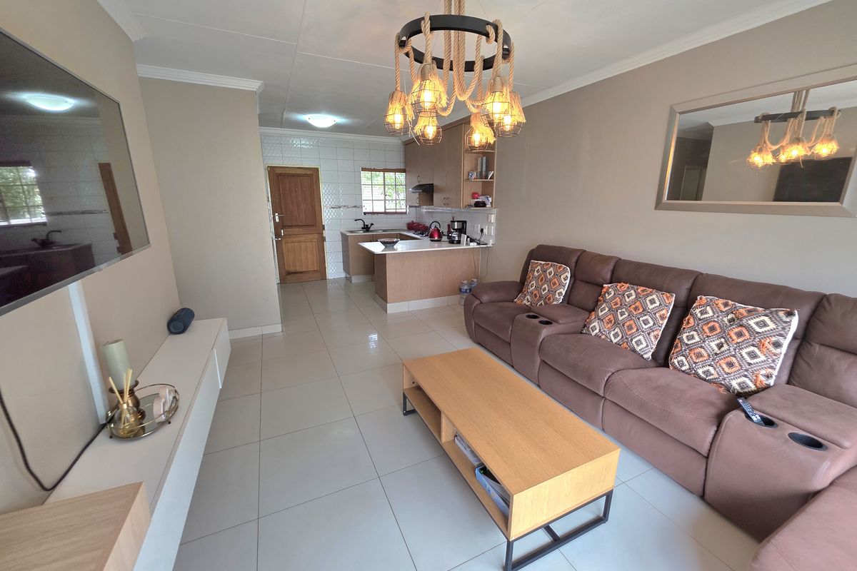 Modern living in a secure, family-friendly area! - Photo 2