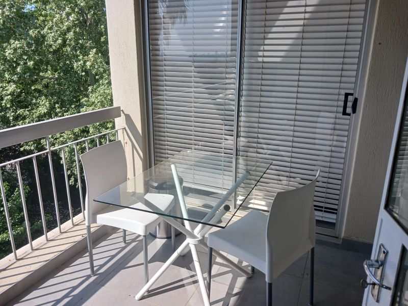 Stylish 2-bedroom furnished apartment to let in Sandhurst, Sandton—perfect for modern urban living! - Photo 2