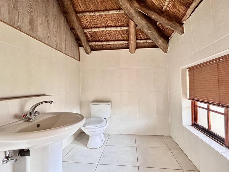 Sprawling Family Sanctuary with Pool in Prestigious Thatchaven Way - Photo 6