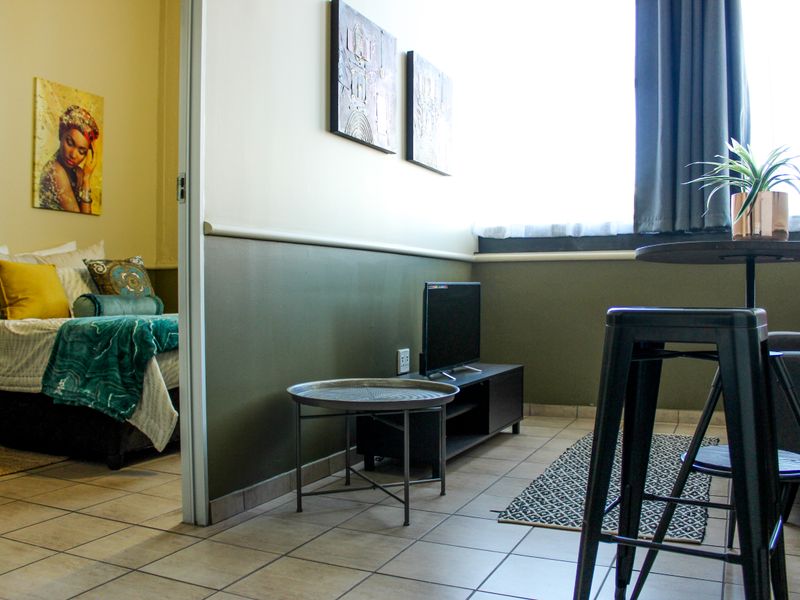 The building offers rooms, bachelor apartments, and one‐bedroom layouts - Photo 4