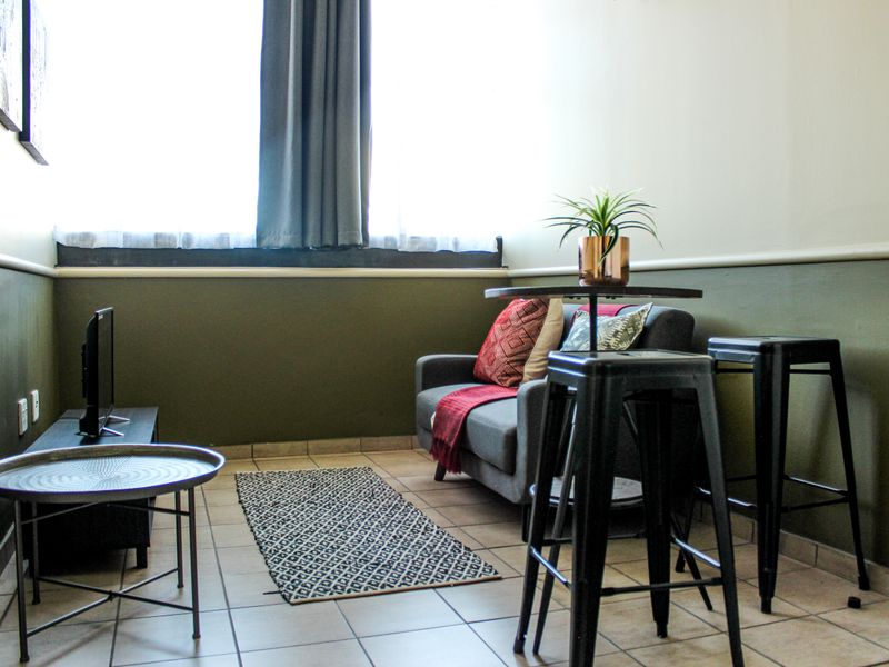 The building offers rooms, bachelor apartments, and one‐bedroom layouts - Photo 2