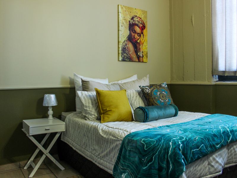 The building offers rooms, bachelor apartments, and one‐bedroom layouts - Photo 1