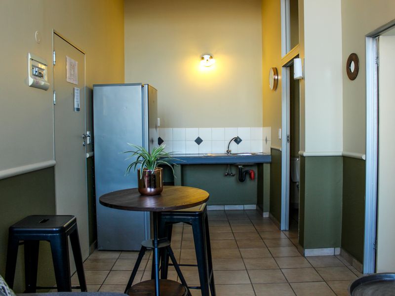 The building offers rooms, bachelor apartments, and one‐bedroom layouts - Photo 7