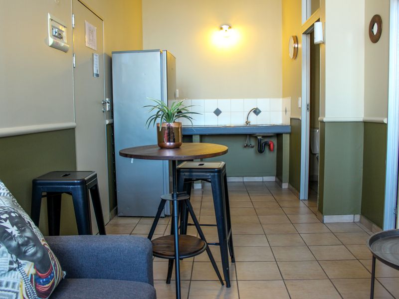 The building offers rooms, bachelor apartments, and one‐bedroom layouts - Photo 6