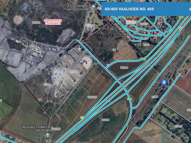 An aerial satellite view showing the industrial land parcel and surrounding infrastructure, including nearby roads and neighboring industrial sites.