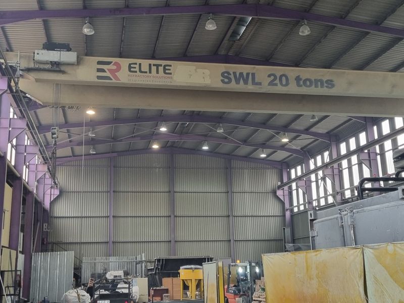 Spacious industrial warehouse facility featuring a high-clearance ceiling, robust steel portal frame construction, and an integrated 20-ton overhead crane system.