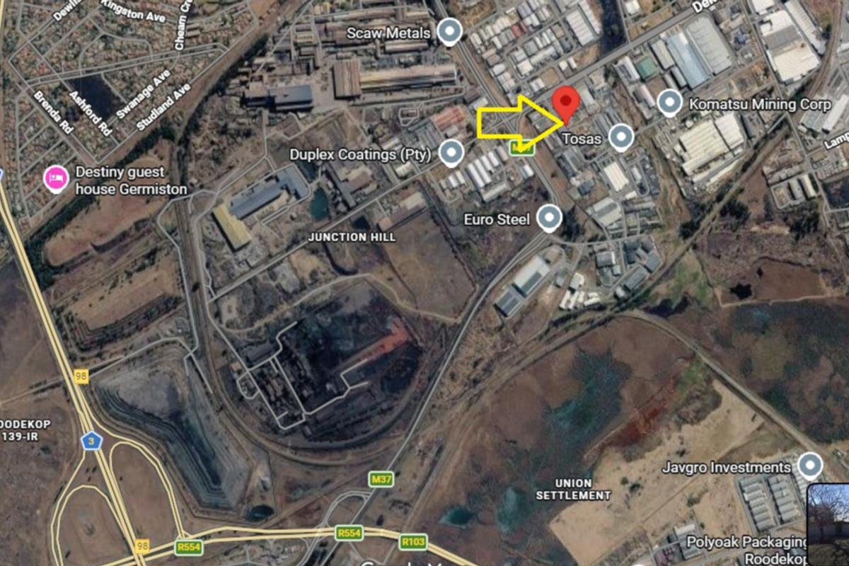 Aerial satellite view showing the industrial property location within the surrounding commercial and transport infrastructure.