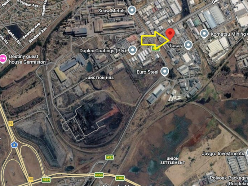 Aerial satellite view showing the industrial property location within the surrounding commercial and transport infrastructure.