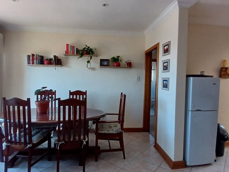 Open plan dining area featuring tiled flooring, recessed lighting, and coving, with direct access to adjacent rooms.