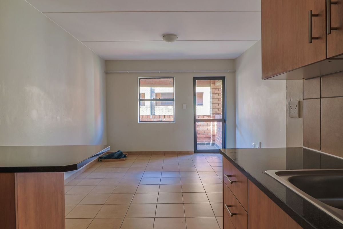 Modern Elegant Two Bedroom Apartment with Single Carport in Sought-After Route 82 Village 1 Complex - Photo 3