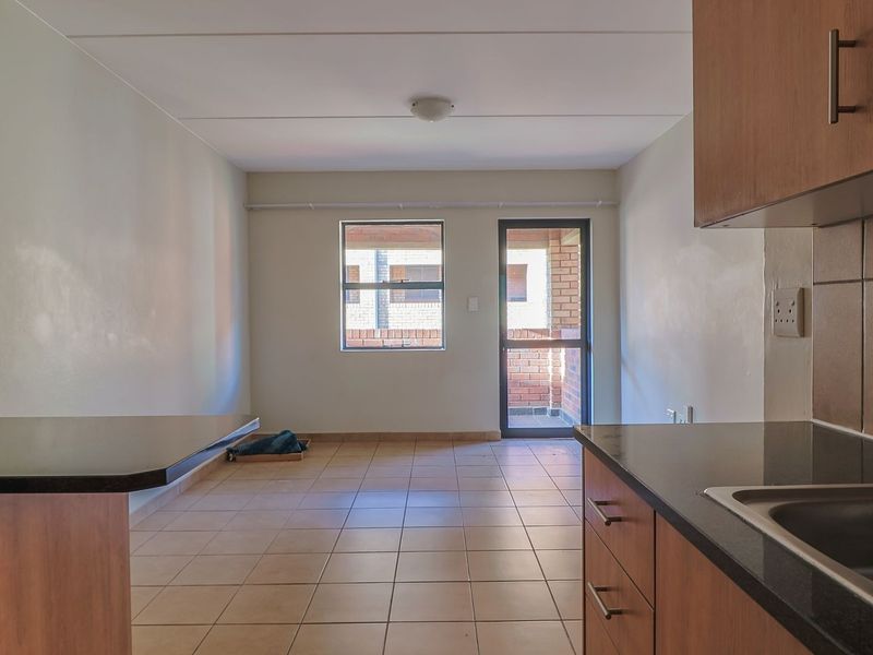 Modern Elegant Two Bedroom Apartment with Single Carport in Sought-After Route 82 Village 1 Complex - Photo 3