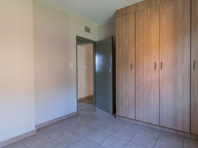 Modern Elegant Two Bedroom Apartment with Single Carport in Sought-After Route 82 Village 1 Complex - Photo 10