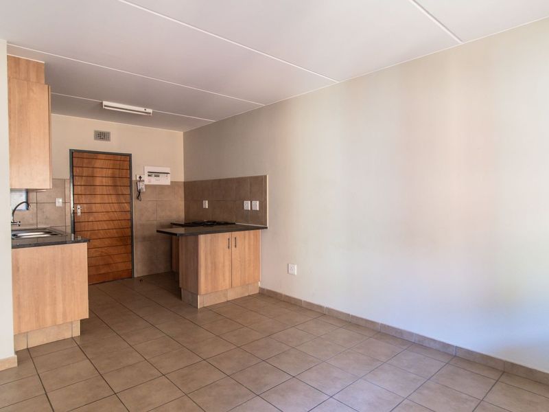 Modern Elegant Two Bedroom Apartment with Single Carport in Sought-After Route 82 Village 1 Complex - Photo 8