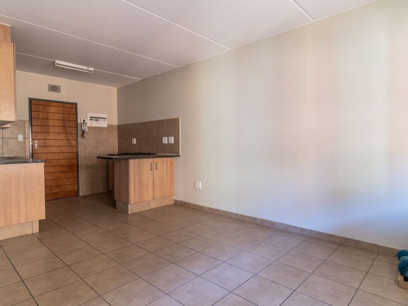 Modern Elegant Two Bedroom Apartment with Single Carport in Sought-After Route 82 Village 1 Complex - Photo 7