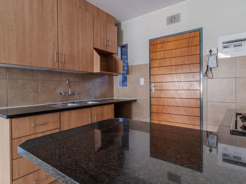 Modern Elegant Two Bedroom Apartment with Single Carport in Sought-After Route 82 Village 1 Complex - Photo 5