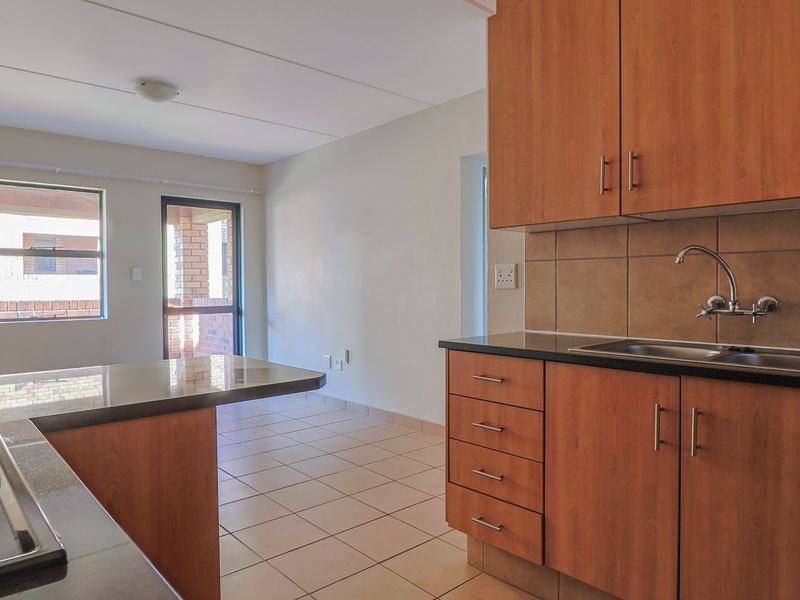 Modern Elegant Two Bedroom Apartment with Single Carport in Sought-After Route 82 Village 1 Complex - Photo 2