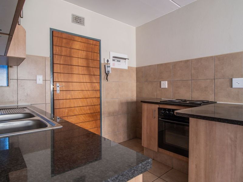 Modern Elegant Two Bedroom Apartment with Single Carport in Sought-After Route 82 Village 1 Complex - Photo 4