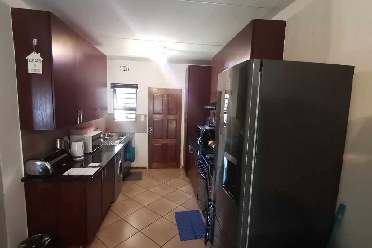 Modern Three Bedroom Ground Floor Apartment with Two Covered Carports in sought -after Storks Nest - Photo 5