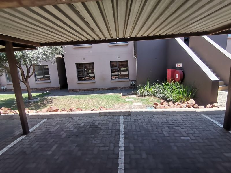 Modern Three Bedroom Ground Floor Apartment with Two Covered Carports in sought -after Storks Nest - Photo 4