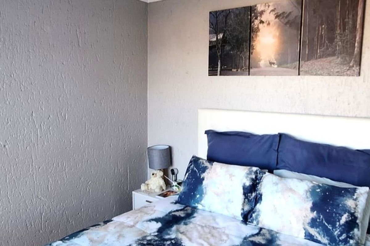 A bedroom featuring textured wall finishes, providing a neutral backdrop for personal styling.