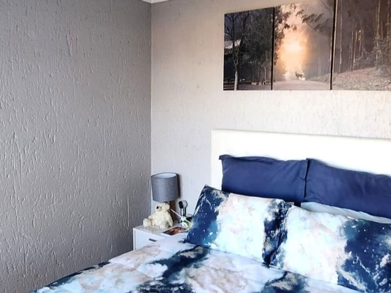 A bedroom featuring textured wall finishes, providing a neutral backdrop for personal styling.
