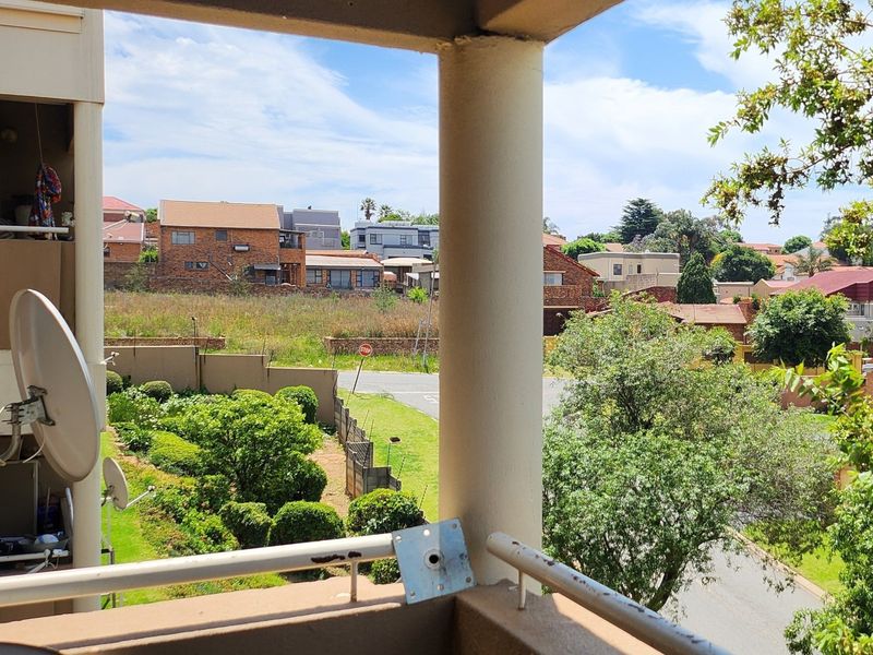An elevated balcony area offering an open view of the surrounding residential neighbourhood and street.