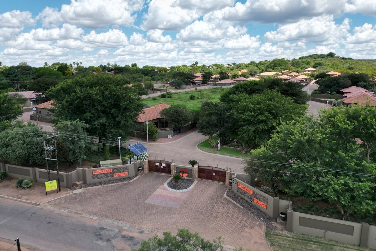 Aerial view of the gated entrance and security access point for the Bospoort Vallei residential estate.