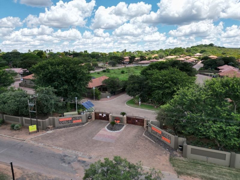Aerial view of the gated entrance and security access point for the Bospoort Vallei residential estate.