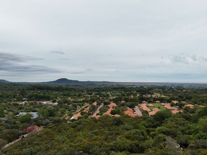 An aerial view of the surrounding residential landscape and natural vegetation.
