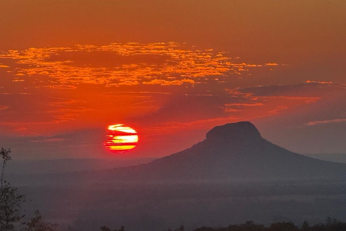 A scenic sunset view over the landscape, highlighting the natural beauty and horizon of the property area.