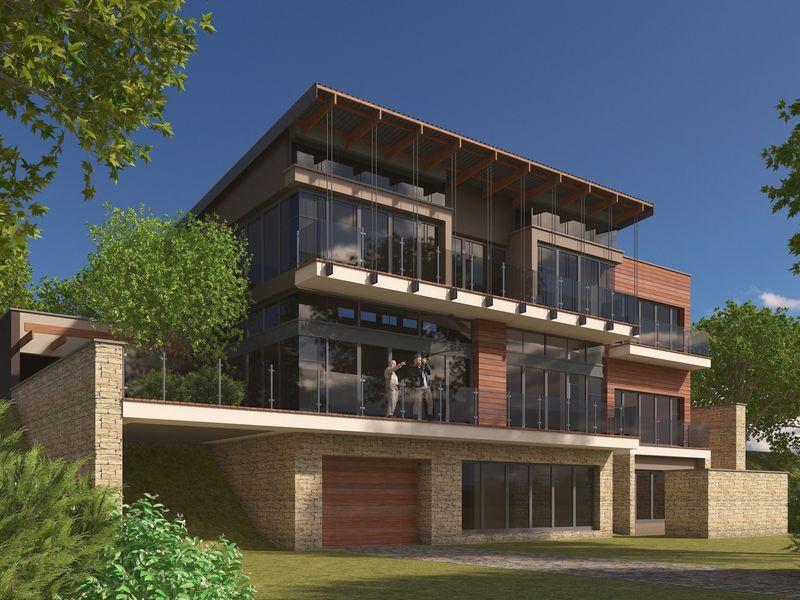 A modern multi-story residential property featuring stone and timber cladding, expansive glass windows, and integrated balconies.