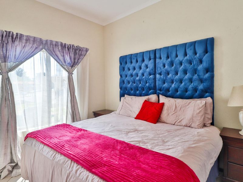 A standard bedroom featuring neutral wall finishes and coving, providing a functional space for a double bed setup.