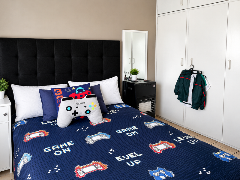 A well-maintained bedroom featuring neutral wall tones, tiled flooring, and ample built-in cupboard storage.