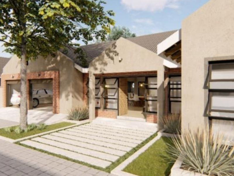 Front elevation of a modern residential property featuring a brick facade, tiled roof, integrated garage, and paved driveway with landscaped garden elements.