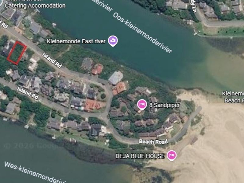 Aerial satellite view showing the location of the vacant residential plot in relation to the river and surrounding coastal neighborhood.