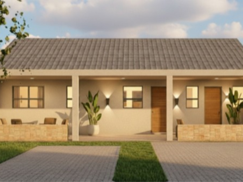 A modern townhouse front elevation featuring a covered patio, paved driveway, and stone-clad accents, presented as a clean architectural rendering.