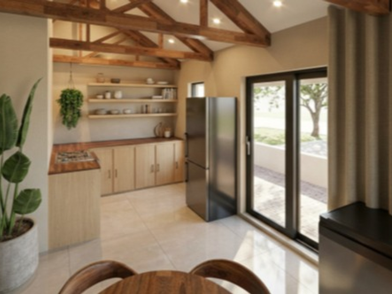 Modern kitchen featuring exposed timber roof trusses, light wood cabinetry, floating shelves, and direct access to the outdoor area through sliding glass doors.