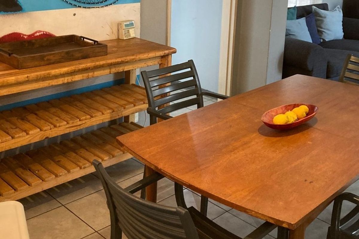 A dining area featuring tiled flooring, providing a functional space for meals within the home.