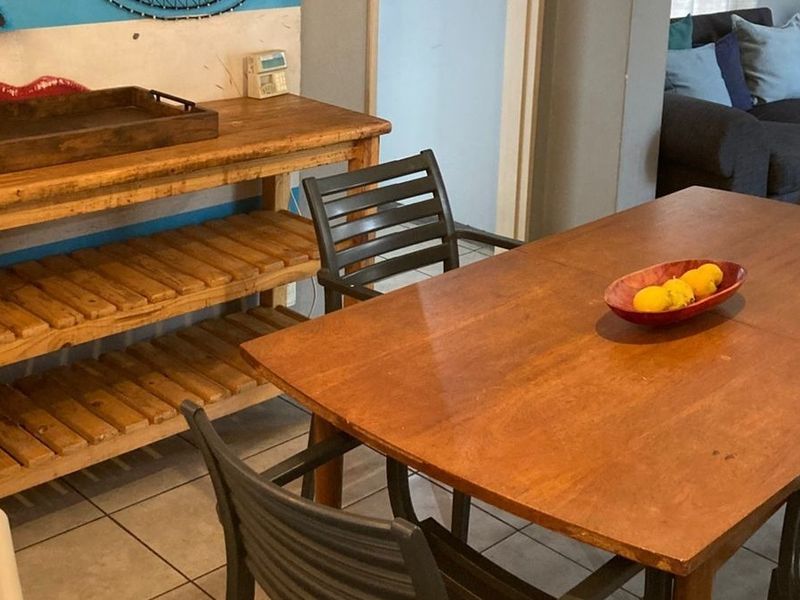 A dining area featuring tiled flooring, providing a functional space for meals within the home.